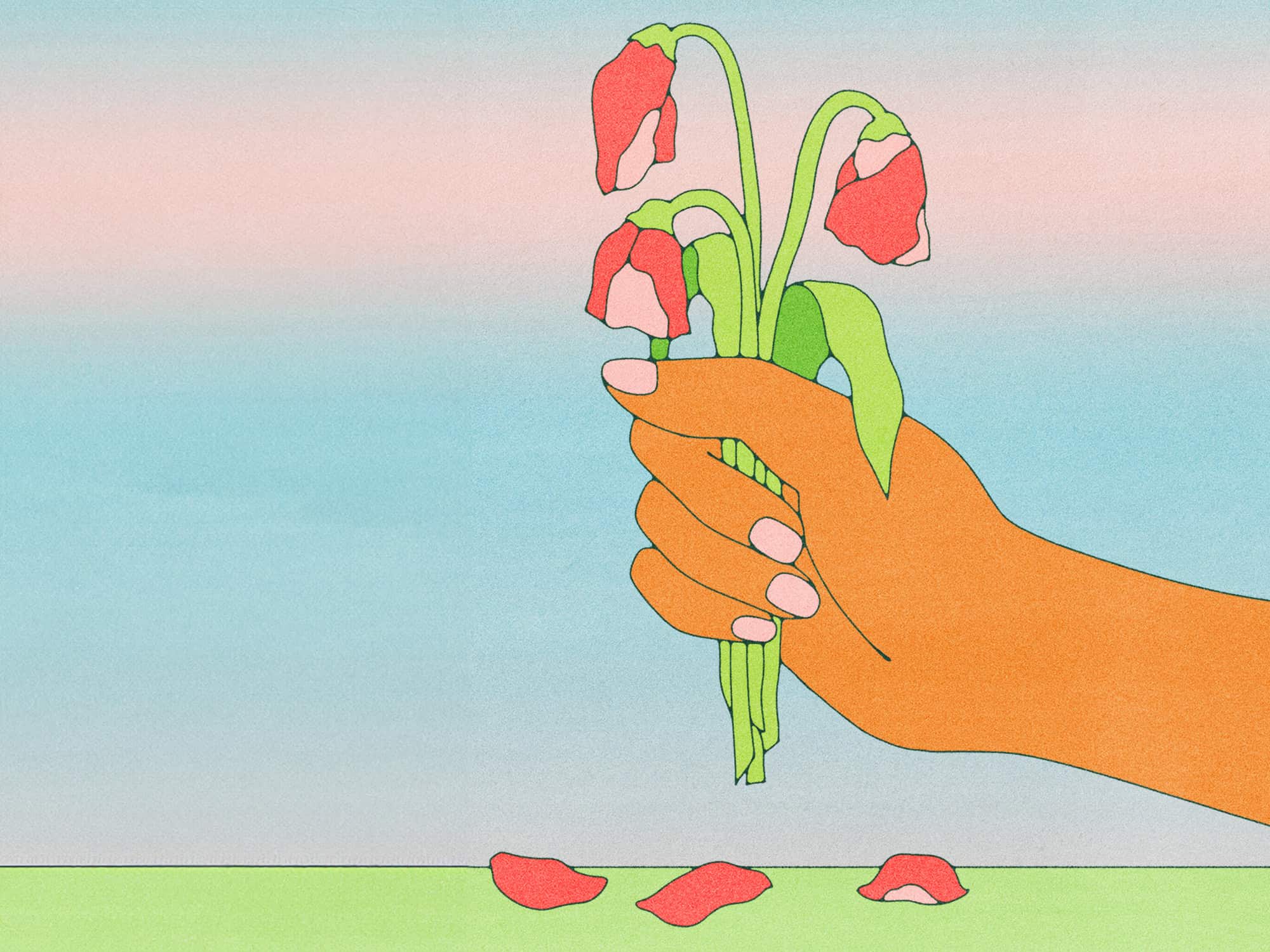 a hand holding flowers